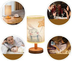 Minimalist Bedside Table Lamp cute childrens bunny holding colored holiday balls in hands holiday Wood Nightstand Lamp Bedside Desk Lamp Wood Base Flaxen Fabric Shade for Bedroom Living Room