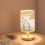 Minimalist Bedside Table Lamp cute childrens bunny holding colored holiday balls in hands holiday Wood Nightstand Lamp Bedside Desk Lamp Wood Base Flaxen Fabric Shade for Bedroom Living Room
